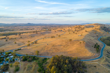 Riverina Highway passing through scenic countryside at sunset. New South Wales, Australia