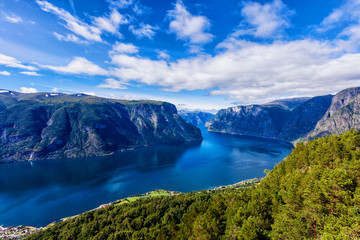 Naklejka na ściany i meble Amazing nature view with fjord and mountains. Beautiful reflection. Location: Scandinavian Mountains, Norway.