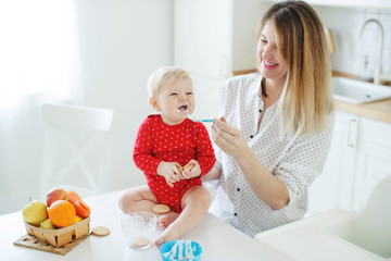 Mother feeds the child 