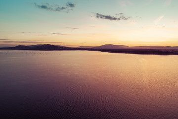 Scenic mountain lake at sunset - aerial view with copy space