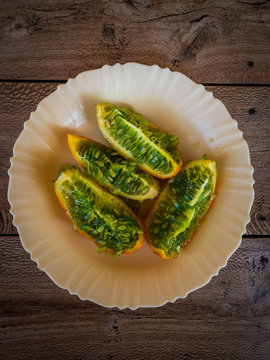 Tropical fruit kiwano or horned melon on a white plate