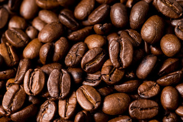 Roasted brown coffee beans, full frame and background