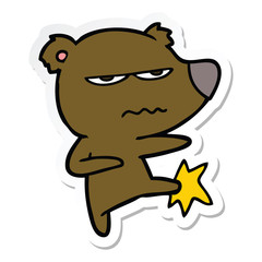 sticker of a angry bear cartoon kicking