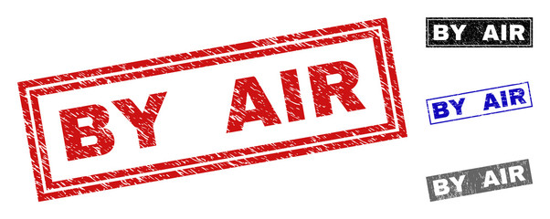 Grunge BY AIR rectangle stamp seals isolated on a white background. Rectangular seals with grunge texture in red, blue, black and gray colors.