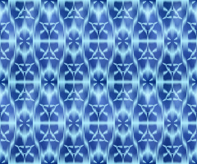 Indigo shibori dyed textile seamless pattern. Bohemian ikat ink background.