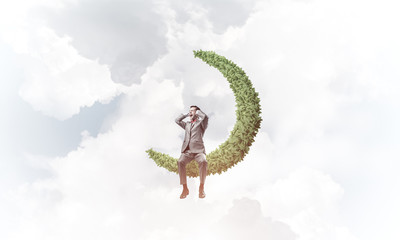 Young man in sky on moon do not want to hear anything
