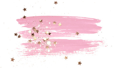 Golden glitter and glittering stars on abstract pink watercolor splash on white background