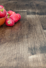 Top view of radishes  on wooden background