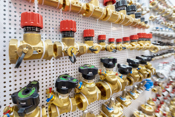 A variety of plumbing pipe connectors, corners, fittings, nipples.