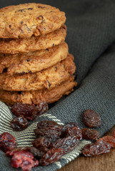 Vertical shot of a stack of cookies on dark kitchen cloth