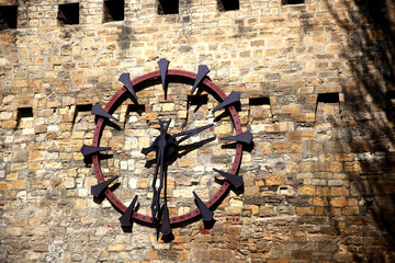 Clock on the wall of the old fortress. Baku city. Republic of Azerbaijan