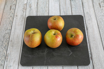 apples on wooden table