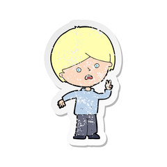 retro distressed sticker of a cartoon unhappy boy giving peace sign