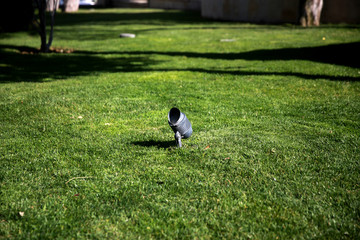 Close up spotlights in the green field	