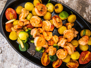 Shrimps fried on pan with vegetables