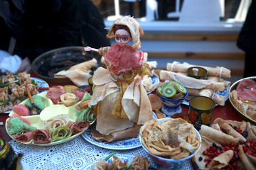 Pancake snack in a white plate, pancakes rolled in the form of bags 