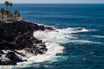 beautiful view on blue ocean water and rocky coast line