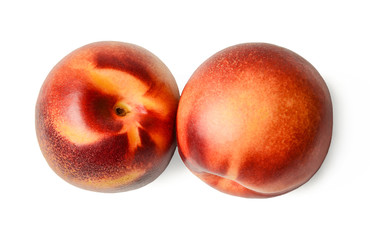 Two nectarines on a white isolated background. View from above. Close-up.