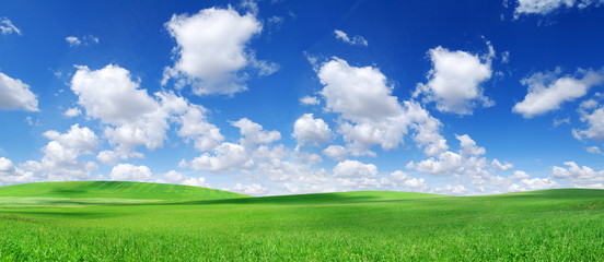 Idyllic view, green hills and blue sky with white clouds - obrazy, fototapety, plakaty
