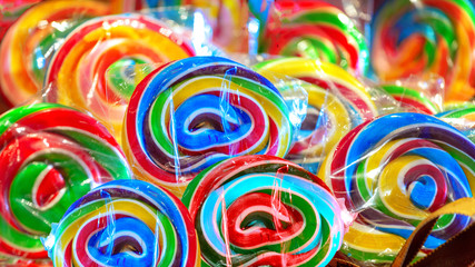 Fototapeta na wymiar Colorful Colorful lollipop swirl, background from delicious multicolored candy