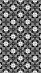 Ornate geometric pattern and two-tone abstract background