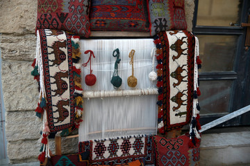 Multi-colored wool yarn on a loom for carpets 
