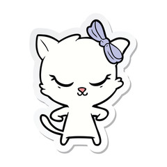 sticker of a cute cartoon cat with bow