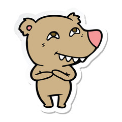 sticker of a cartoon bear showing teeth