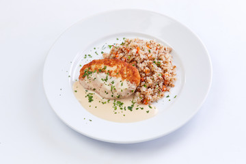 cutlet with buckwheat on the white background