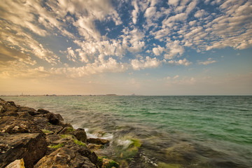 Rocks with green moss in some part of Wakra bay