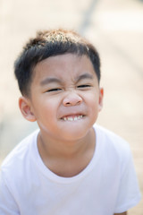 close up tooth and kidding face of asian children  standing outdoor