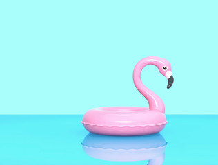 Inflatable flamingo on blue reflective surface