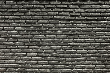rough dark brick wall surface, abstract background texture