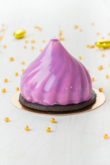French mousse cake covered with mirror glaze