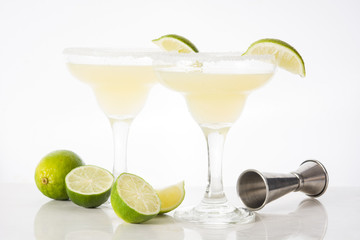 Margarita cocktails with lime in glass isolated on white background. 