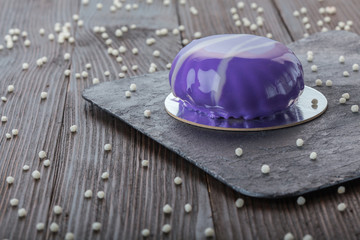 French mousse cake covered with mirror glaze