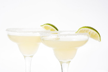 Margarita cocktails with lime in glass isolated on white background. 