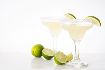 Margarita cocktails with lime in glass isolated on white background. Copyspace