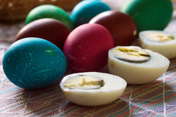 Easter painted eggs. Multicolored.In a shell and three cut halves. Preparation for the holiday.