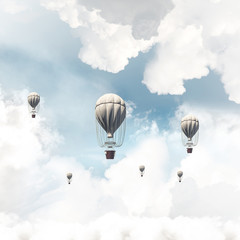Flying hot air balloons in the air.