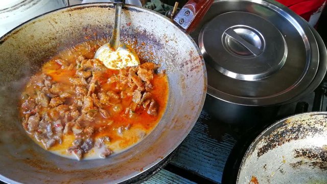 Thailand food ( Spicy Beef curry ) Stir fried Beef or pork with Curry spicy delicious in pan . Most popular menus and recommend in the country of Thailand.