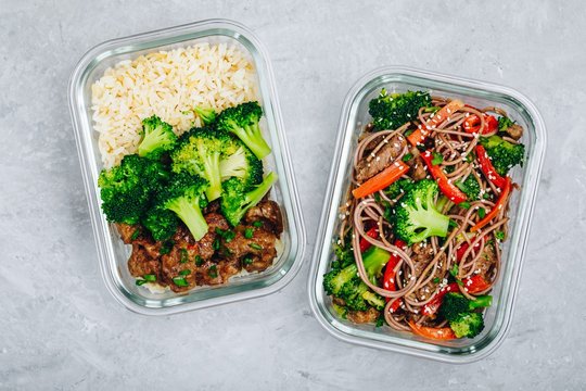 Beef and broccoli stir fry meal prep lunch box containers with rice or noodles
