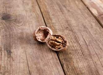 walnuts on a rustic wooden table - close up