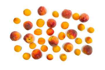 Fresh orange apricots and peaches fruits on white background. Top view, flat lay