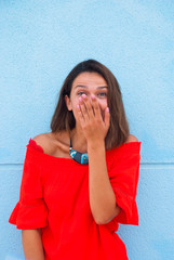 Portrait of surprised woman with hand closed her mouth. Wow effect.