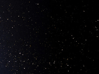 balck background with goolden stardust