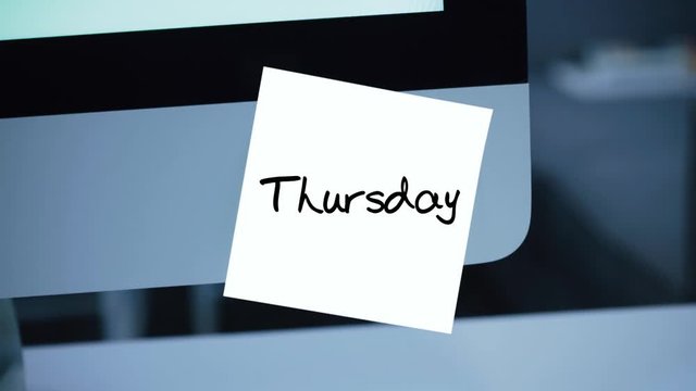 Thursday. Days of the week. The inscription on the sticker on the monitor. Message. Motivation. Reminder. Handwritten text written with a marker. Color sticker. A message for an employee, a colleague