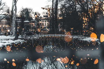 Lights wires bokeh in snowy winter city
