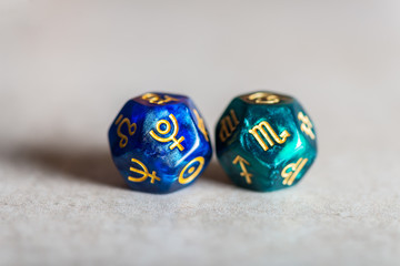 Astrology Dice with zodiac symbol of Scorpio and its ruling planet Pluto