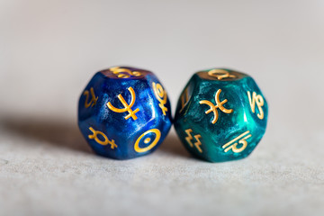 Astrology Dice with zodiac symbol of Pisces and its ruling planet Neptune